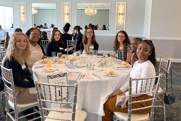 Students at a table attending college event